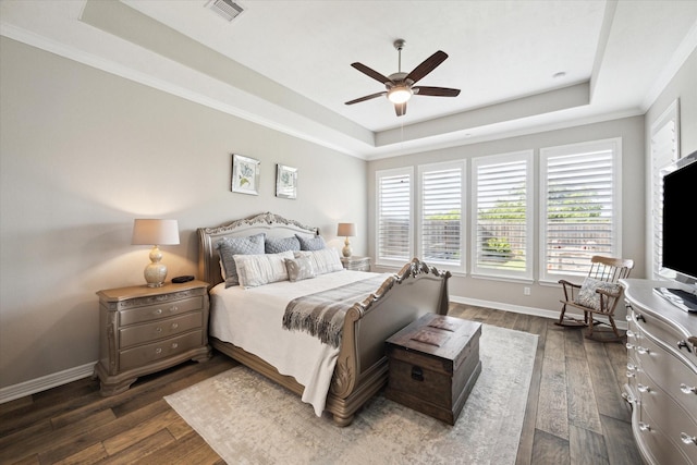 5946 Wedgewood Heights Way, Houston, TX 77059 - bedroom featuring a raised ceiling, dark wood-style flooring, a ceiling fan, and crown molding