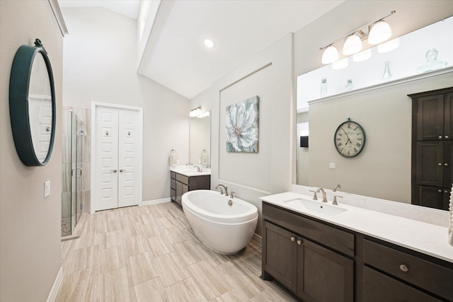 5946 Wedgewood Heights Way, Houston, TX 77059 - full bath with a shower stall, two vanities, a freestanding bath, and high vaulted ceiling