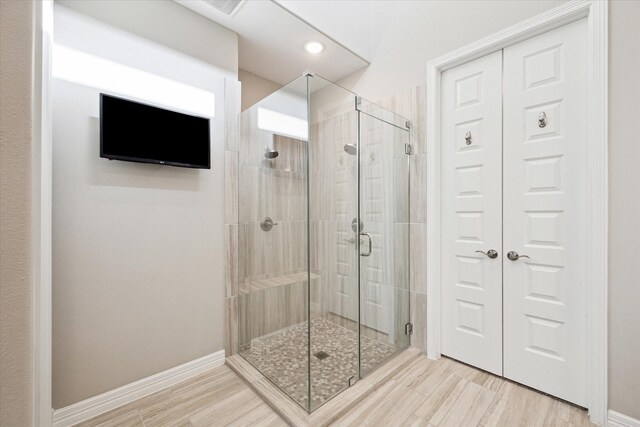 5946 Wedgewood Heights Way, Houston, TX 77059 - bathroom with a shower stall, wood finished floors, and recessed lighting