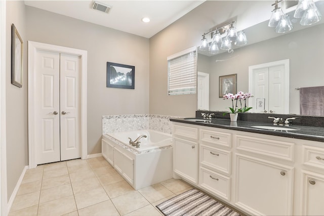 826 E 29th St, Houston, TX 77009 - full bathroom with double vanity, tile patterned floors, and a bath