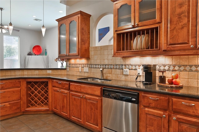 826 E 29th St, Houston, TX 77009 - kitchen featuring stainless steel dishwasher, hanging light fixtures, tile patterned floors, backsplash, and ceiling fan