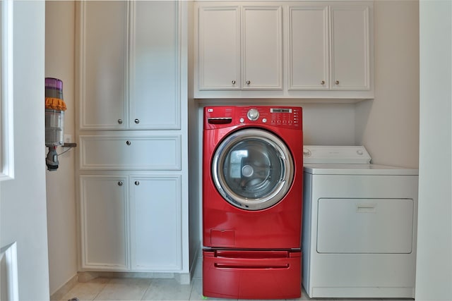 826 E 29th St, Houston, TX 77009 - washroom featuring washer and clothes dryer and cabinet space