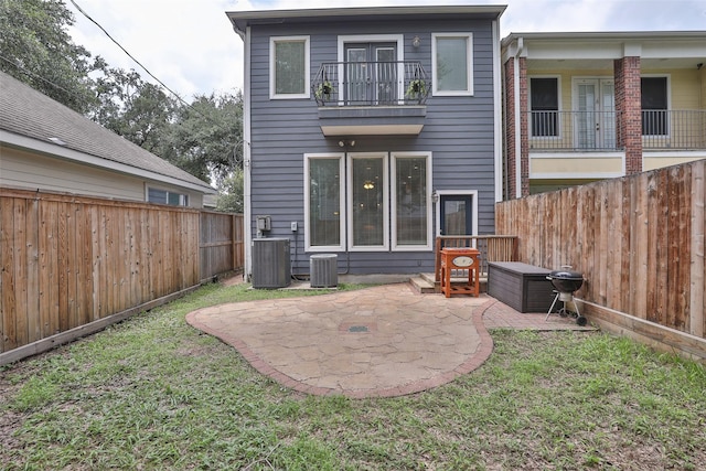 826 E 29th St, Houston, TX 77009 - rear view of house featuring a patio, a fenced backyard, and a balcony