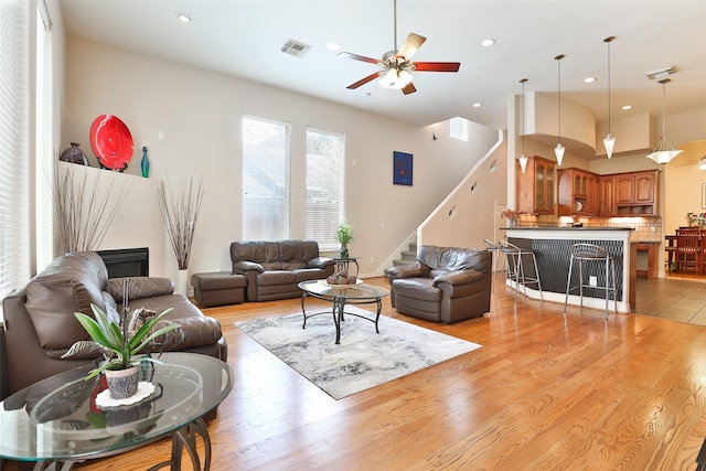 826 E 29th St, Houston, TX 77009 - living room with stairs, ceiling fan, light wood-style flooring, and recessed lighting