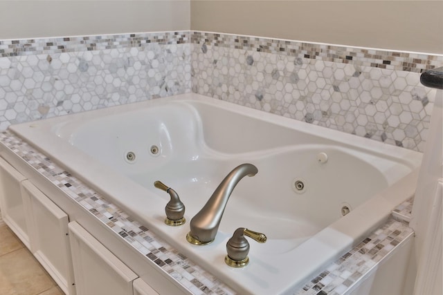 826 E 29th St, Houston, TX 77009 - full bathroom with a whirlpool tub and tile patterned floors
