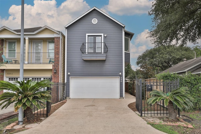 826 E 29th St, Houston, TX 77009 - view of front of home featuring a balcony, a garage, concrete driveway, and french doors