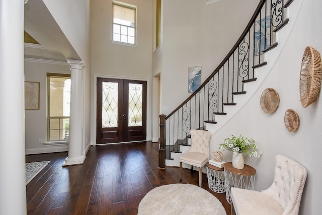 5450 Pudman River Ln, Sugar Land, TX 77479 - entrance foyer with ornate columns, stairway, hardwood / wood-style flooring, ornamental molding, and french doors