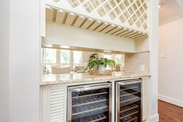 5450 Pudman River Ln, Sugar Land, TX 77479 - indoor bar featuring wine cooler, dark wood finished floors, and backsplash