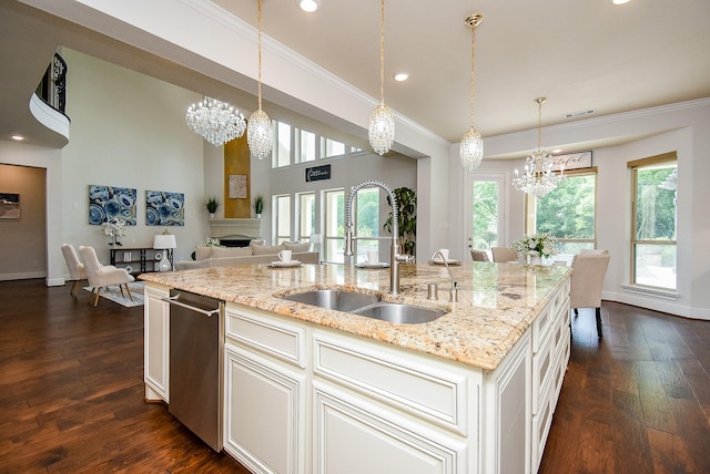 5450 Pudman River Ln, Sugar Land, TX 77479 - kitchen featuring a chandelier, healthy amount of natural light, a fireplace, ornamental molding, and recessed lighting