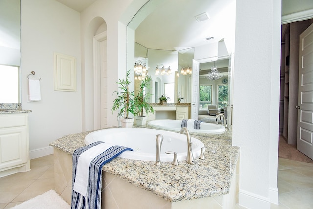 5450 Pudman River Ln, Sugar Land, TX 77479 - full bathroom featuring tile patterned floors, vanity, a whirlpool tub, and a chandelier