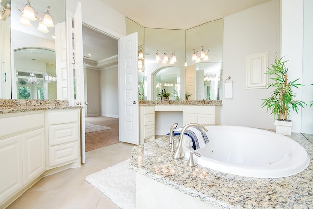 5450 Pudman River Ln, Sugar Land, TX 77479 - full bath with tile patterned flooring, vanity, a jetted tub, and a chandelier