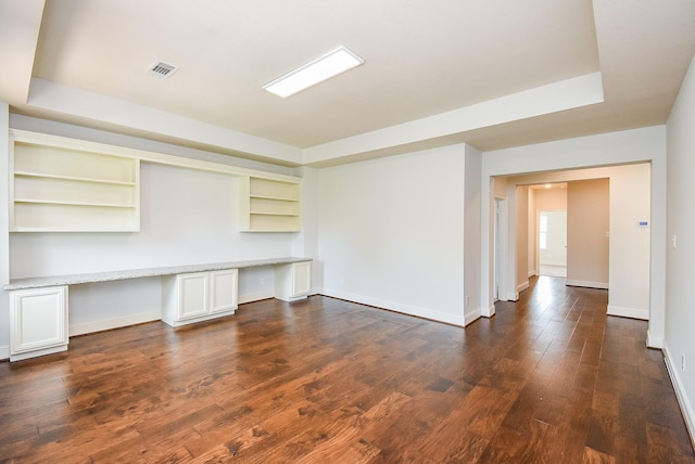 5450 Pudman River Ln, Sugar Land, TX 77479 - unfurnished office with built in desk, dark wood finished floors, and built in shelves