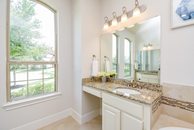 5450 Pudman River Ln, Sugar Land, TX 77479 - bathroom featuring vanity, a tub to relax in, and tile patterned floors
