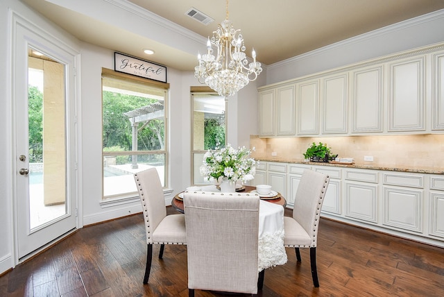 5450 Pudman River Ln, Sugar Land, TX 77479 - dining room with ornamental molding, a chandelier, and dark wood-style floors