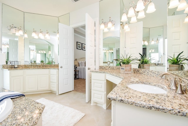 5450 Pudman River Ln, Sugar Land, TX 77479 - ensuite bathroom with two vanities, tile patterned flooring, and a chandelier