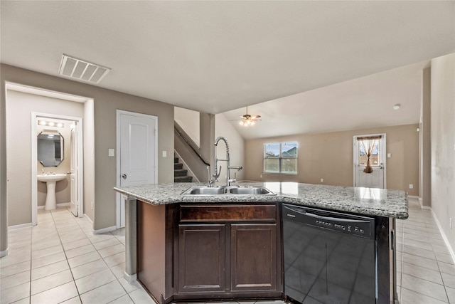 2926 Indwarra Ct, Katy, TX 77494 - kitchen with black dishwasher, light tile patterned floors, a kitchen island with sink, and dark brown cabinets