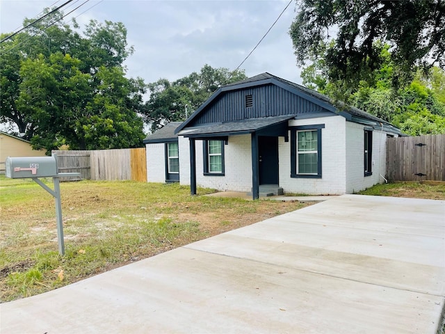506 N Hackberry St, Sweeny, TX 77480 - view of front facade featuring brick siding and a shingled roof