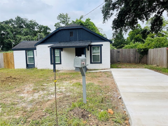506 N Hackberry St, Sweeny, TX 77480 - view of front facade featuring roof with shingles and brick siding