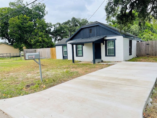506 N Hackberry St, Sweeny, TX 77480 - view of front of property featuring brick siding, roof with shingles, and concrete driveway