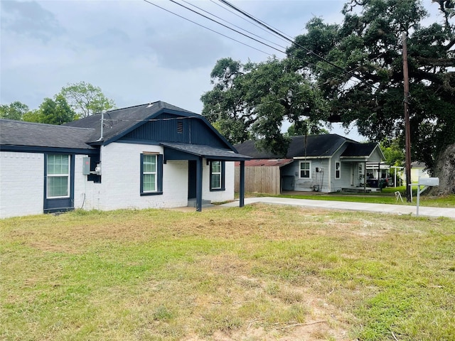 506 N Hackberry St, Sweeny, TX 77480 - view of front of property featuring a front yard, brick siding, and roof with shingles