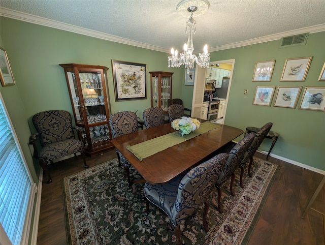 14453 Misty Meadow Ln, Houston, TX 77079 - dining room featuring ornamental molding, a chandelier, dark wood finished floors, and a textured ceiling