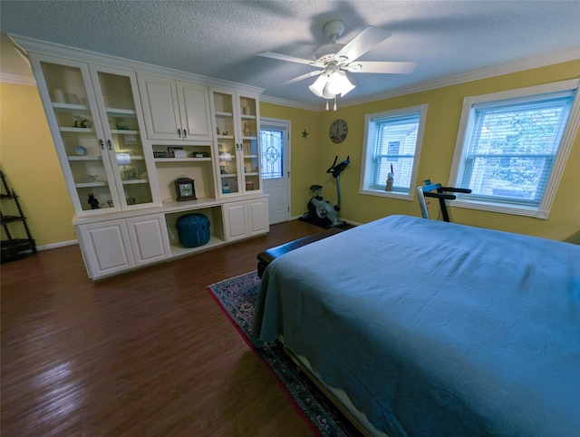 14453 Misty Meadow Ln, Houston, TX 77079 - bedroom featuring crown molding, dark wood finished floors, a textured ceiling, and a ceiling fan