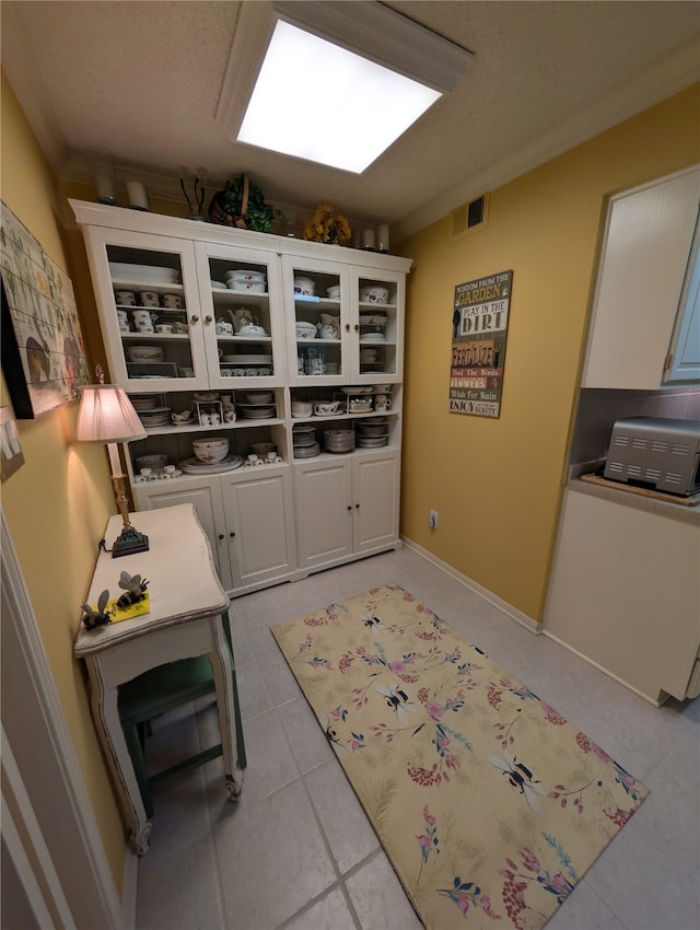 14453 Misty Meadow Ln, Houston, TX 77079 - office with light tile patterned floors and a textured ceiling