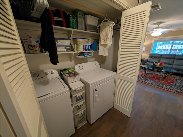14453 Misty Meadow Ln, Houston, TX 77079 - laundry area with washing machine and dryer, dark wood-style floors, and a ceiling fan