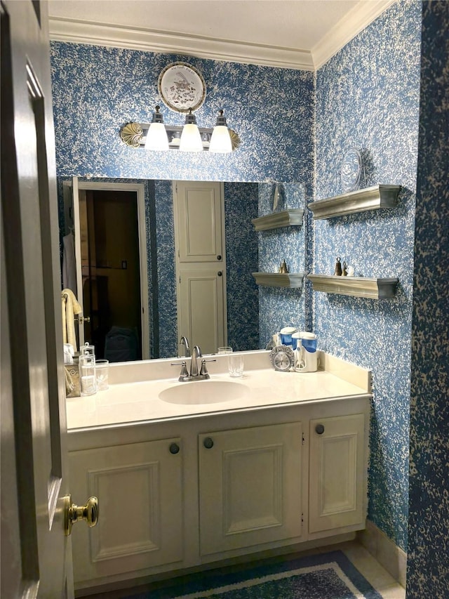 14453 Misty Meadow Ln, Houston, TX 77079 - bathroom with wallpapered walls, crown molding, and vanity