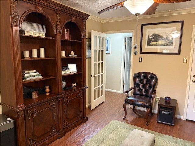 14453 Misty Meadow Ln, Houston, TX 77079 - sitting room with wood finished floors, a ceiling fan, ornamental molding, and a textured ceiling