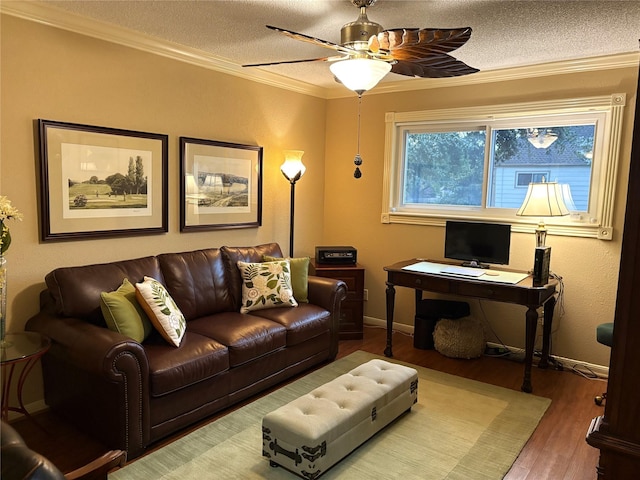 14453 Misty Meadow Ln, Houston, TX 77079 - living area featuring wood finished floors, a textured ceiling, a ceiling fan, and crown molding