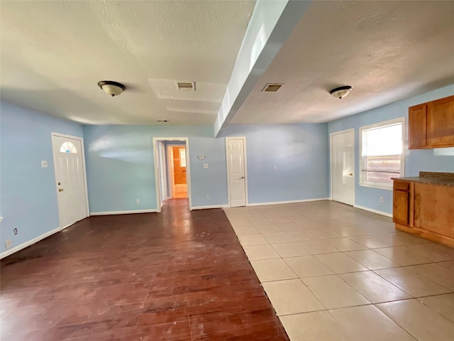 3707 Rosemont St, Houston, TX 77051 - unfurnished living room featuring a textured ceiling and tile patterned floors