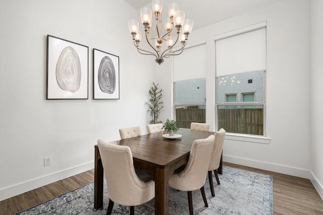 3019 Bluestem Rd, Katy, TX 77493 - dining area featuring a chandelier and wood finished floors