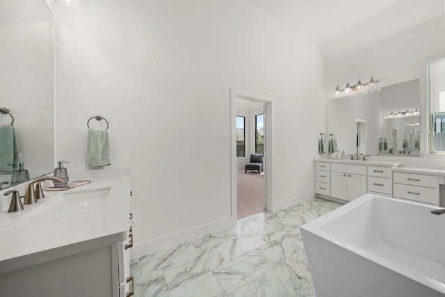 3019 Bluestem Rd, Katy, TX 77493 - full bath with marble look tiles, a freestanding bath, and vanity