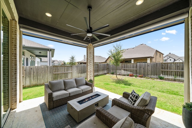 3019 Bluestem Rd, Katy, TX 77493 - fenced backyard featuring an outdoor living space with a fire pit, a patio area, ceiling fan, and a residential view