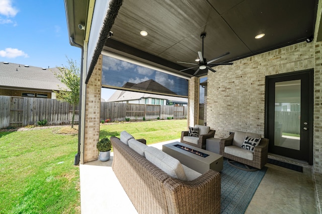 3019 Bluestem Rd, Katy, TX 77493 - fenced backyard with an outdoor living space with a fire pit, a patio area, and a ceiling fan