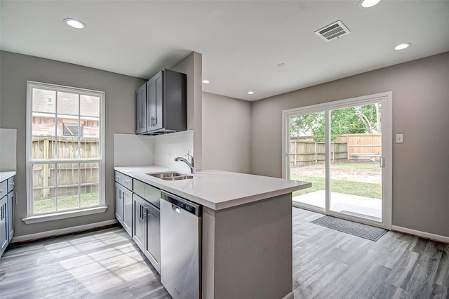 7918 Battleoak Dr, Houston, TX 77040 - kitchen featuring dishwasher, gray cabinetry, light wood finished floors, light countertops, and recessed lighting