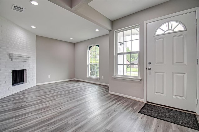 7918 Battleoak Dr, Houston, TX 77040 - foyer with wood finished floors, recessed lighting, and a brick fireplace