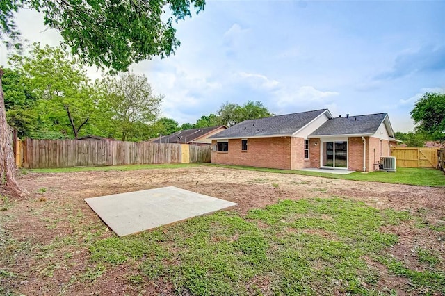 7918 Battleoak Dr, Houston, TX 77040 - back of house featuring a patio area, brick siding, a fenced backyard, and roof with shingles