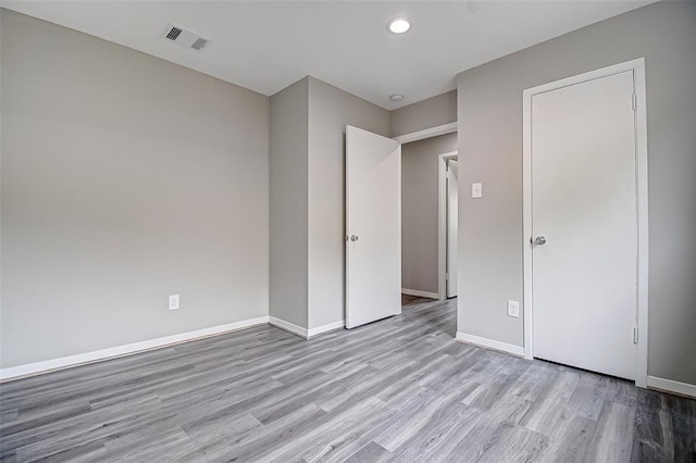 7918 Battleoak Dr, Houston, TX 77040 - unfurnished bedroom featuring wood finished floors and recessed lighting