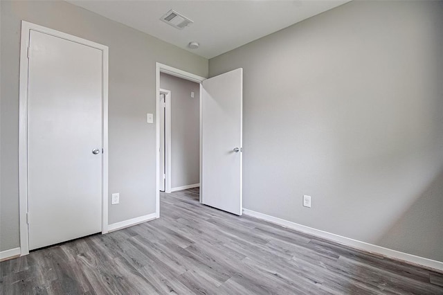 7918 Battleoak Dr, Houston, TX 77040 - unfurnished bedroom featuring wood finished floors and baseboards
