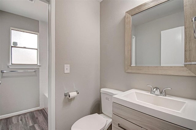 7918 Battleoak Dr, Houston, TX 77040 - full bathroom with vanity, wood finished floors, and shower / tub combination