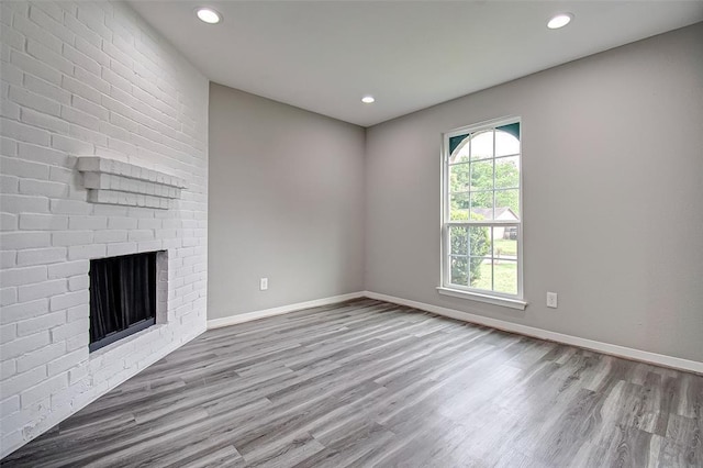 7918 Battleoak Dr, Houston, TX 77040 - unfurnished living room with wood finished floors, recessed lighting, and a fireplace