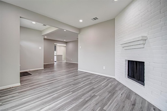 7918 Battleoak Dr, Houston, TX 77040 - unfurnished living room featuring wood finished floors, recessed lighting, and a fireplace