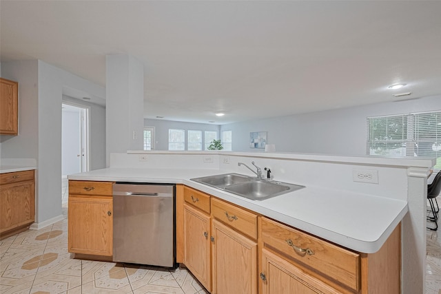 2123 Gable Hollow Ln, Katy, TX 77450 - kitchen with stainless steel dishwasher, light countertops, plenty of natural light, light tile patterned floors, and recessed lighting