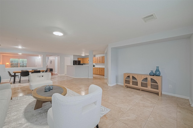 2123 Gable Hollow Ln, Katy, TX 77450 - living room featuring light tile patterned floors and baseboards