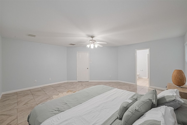 2123 Gable Hollow Ln, Katy, TX 77450 - bedroom with ceiling fan, connected bathroom, and light tile patterned flooring