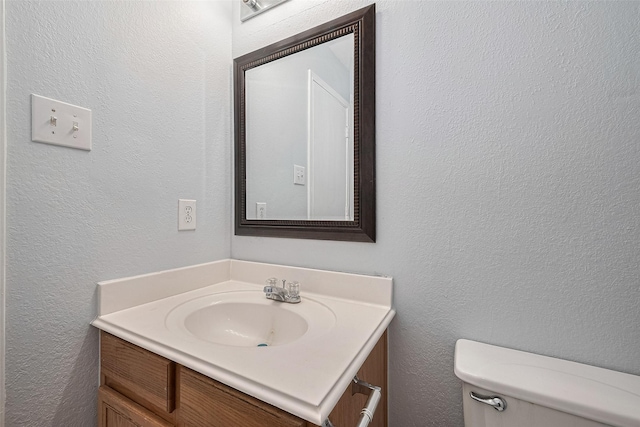 2123 Gable Hollow Ln, Katy, TX 77450 - half bathroom with vanity and a textured wall