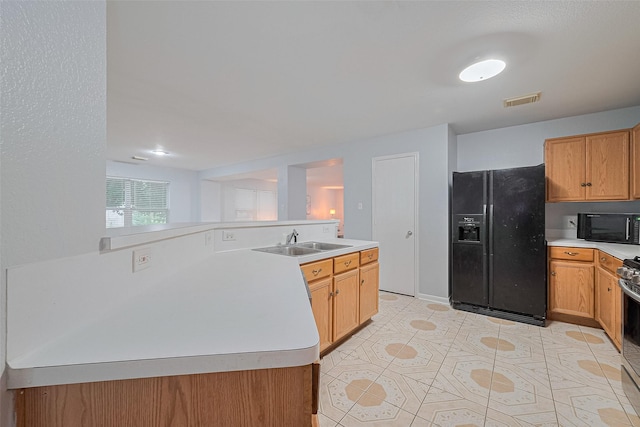 2123 Gable Hollow Ln, Katy, TX 77450 - kitchen with black appliances, light countertops, and light tile patterned floors