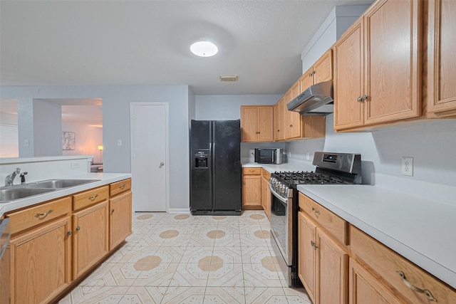 2123 Gable Hollow Ln, Katy, TX 77450 - kitchen with appliances with stainless steel finishes, under cabinet range hood, light countertops, and light tile patterned floors